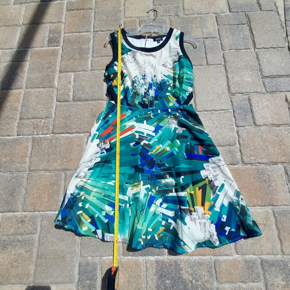 XOXO Cute Dress with open sides to show a little skin!  Super cute!  size 8-10.